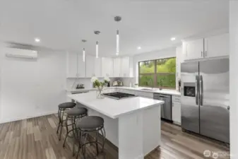 The light filled kitchen is a natural gathering place for entertaining.