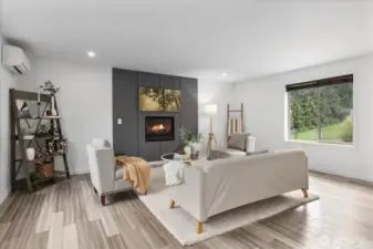A gas fireplace brightens and warms the room on chilly Pacific Northwest nights.