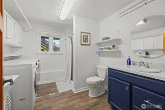 Lower level laundry room with 3/4 bathroom