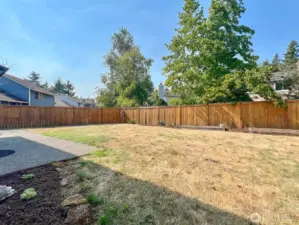 Fenced Yard with Raised Beds
