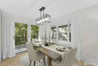 Dining area with double doors to deck