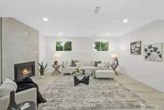 Bonus room with gorgeous cozy gas fireplace. Lower level