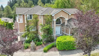 Discover this exquisite multi-level home, perfectly situated on a corner lot in a desirable Auburn neighborhood. The inviting layout features bright, open living spaces filled w/natural light, creating a warm & welcoming atmosphere. A thoughtfully designed kitchen offers ample cabinetry, modern finishes & a seamless flow to the living rm—ideal for entertaining. Upstairs boasts a spacious primary w/en suite, plus 3 guest rooms. Enjoy a main floor office/flex space, and a lower level featuring a large bonus room, guest bath, storage/kitchenette space with wine rack. Endless opportunities w/this spacious layout! Conveniently located near parks, schools, shopping, & major commuter routes, this home combines comfort w/unbeatable accessibility.