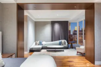 Warm walnut surround separates the bedroom from the large, private sitting room.