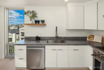 Sweet views from floor-to-ceiling kitchen/dining room toward the east (sunrises!)