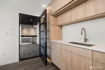 Having the kitchen open to the outdoor heated living space that has its own bar is ingeniously designed.