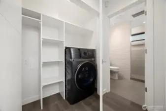 The storage and laundry closet is conveniently located on the main floor between the kitchen and the bathroom.