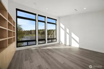 This room is very spacious with tall ceilings as well, and has incredible lake views. It can also have furniture for sleeping and be a dual use room.