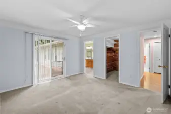 Primary bedroom with slider to the backyard.