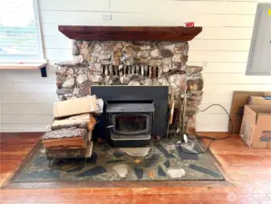 Beautiful fireplace with wood burning insert.