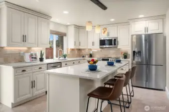 Kitchen with upgraded cabinets, counter tops, recessed lighting, stainless appliances including double oven.