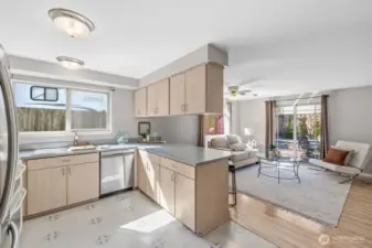 Open kitchen with breakfast bar. New dishwasher.