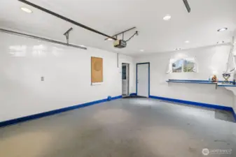 Heated hobby space  providing exceptional storage or use as your third garage bay. Door to back yard.