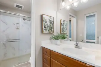 3/4 bathroom in primary suite.