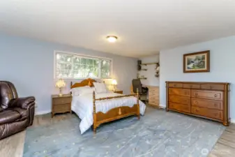 The large primary bedroom with walk in closet