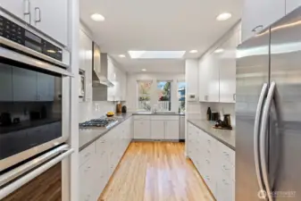 2010 Chefs kitchen with an abundance of cabinets, pull-outs, quartz counters and even a dedicated knife area to hide your sharpest but still have them handy. Stainless appliances included Frigidaire dishwasher, Thermador double oven, GE Monogram microwave, Bosch cooktop, Elkay overhead exhaust hood and KitchenAid side-by-side fridge-freezer.