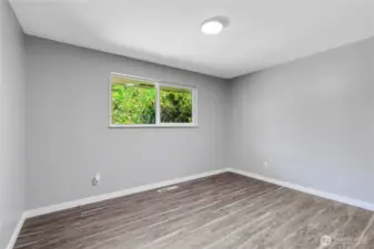 A peaceful retreat with tranquil backyard views, fresh paint, and durable flooring. Ideal for guests, kids, or as an additional office—this room is ready to adapt to your needs.