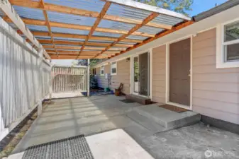 Step outside to your private covered patio—perfect for grilling, morning coffee, or relaxing in the shade. Fully fenced and tucked along the side of the home for added privacy.