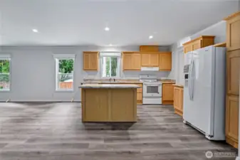 Chefs kitchen with breakfast bar.