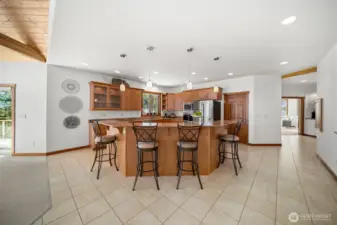 Large granite eating bar/open kitchen layout