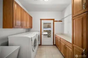 Large utility room with sink and storage