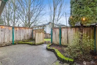 Enjoy your own private backyard patio with its gate that leads to a greenbelt.