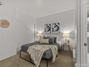 Spacious bedroom and full closet, with en suite bath and sliding, frosted door for separation.