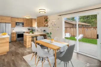 Enjoy cooking in upgraded kitchen with custom cabinetry and subway tiles.