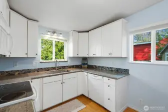 Kitchen with view, open to living/dining spaces,newer appliances and stacking washer/drier