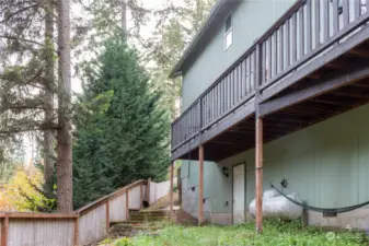 Backyard on a slope with concrete patio