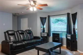 Large living room or family room off of main entrance. Open concept floorplan leads to dining area.