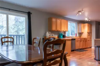 Dining area off of large kitchen with its own eating space