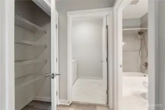 Hallway storage closet next to the dedicated laundry room.