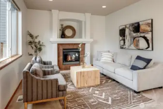 The open layout seamlessly connects to the nook area and family room, which includes a cozy gas fireplace.