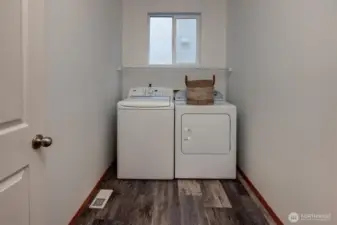 Large utility room on main with window.