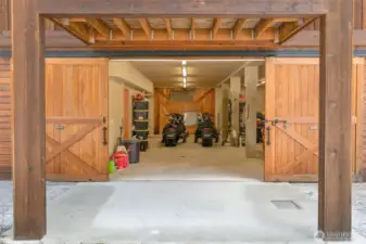 Front sliding barn door style 8X10 garage door opens up to over 1100sqft of covered, heated space for your coveted toys.