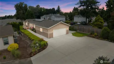 Large back patio off garage by vines and berries to enjoy Spring, summer and fall on!