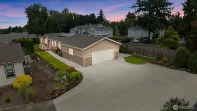 Large back patio off garage by vines and berries to enjoy Spring, summer and fall on!
