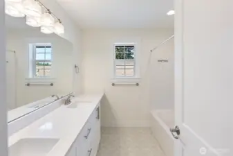 The upstairs hall bath with double vanities.
