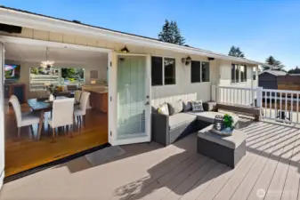 Doors off kitchen and dining space onto deck