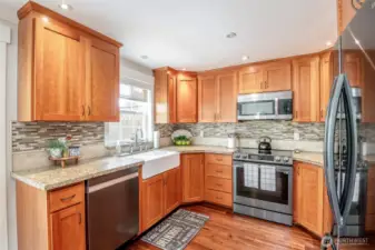 Timeless, rich wood grain millwork, granite counters