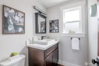 Stylish, updated half bath off eat-in & 2nd living area on main