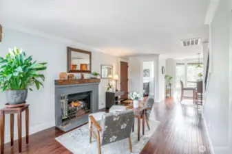 Gas fireplace, hardwoods and deeper, darker vibe sets the mood in the secondary living space
