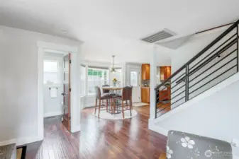 Sleek hardwood & steel stairway to the upper level, easily accessible