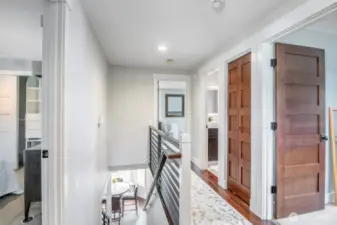 Landing and hall on upper level feature beautiful hardwoods
