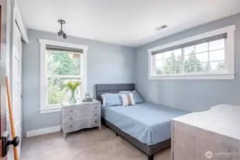 Bedroom 2, also with closet system offers sunset views
