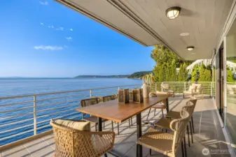 We are now on the main level deck, large enough for multiple entertaining sitting areas. Easy maintenance with the metal railing and composite flooring.