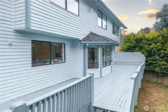 Stairs take you from the deck to the lower back yard.