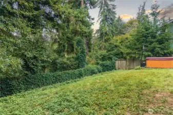 The fully fenced backyard is spacious and ready for your own customization.