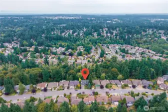 This aerial photo shows the stunning greenbelt behind this lovely neighborhood.